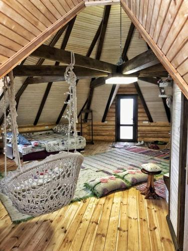 a room with swings and a bed in a house at Lavender House in Slavske