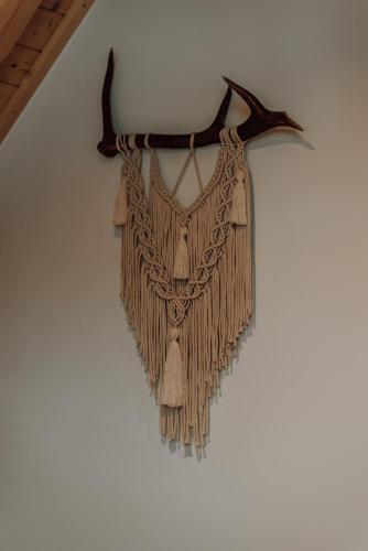 a dream catcher hanging on a wall at Osada Snozka in Kluszkowce
