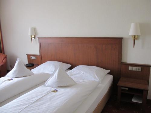 Katil atau katil-katil dalam bilik di Weinhotel Rose