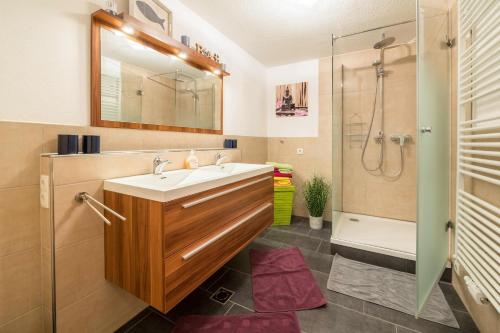 a bathroom with a sink and a shower at Wieseneck I - Apartment in Fügen in Fügen