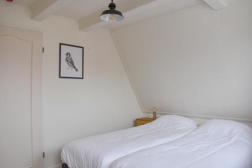 Giường trong phòng chung tại De Welvaart - Logement