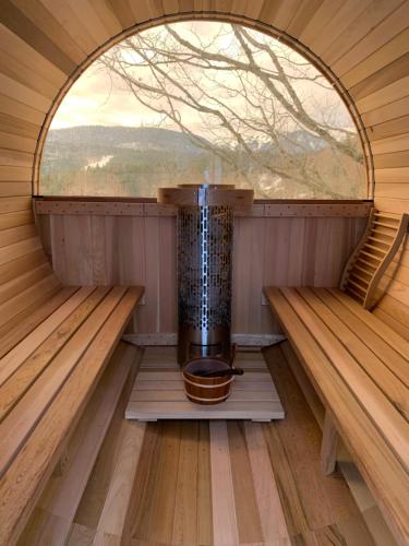 an inside of a sauna with a window at Chalet OTT - apartment in the mountains with sauna in Saint-Cergue