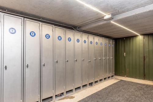 a row of metal lockers in a locker room at Hotel Italo in Madonna di Campiglio