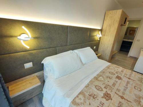 Postel nebo postele na pokoji v ubytování Residence Cristine