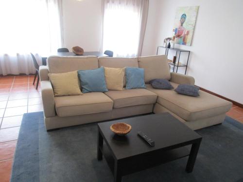 a living room with a couch and a table at The Artist´s Apartment in Espinho