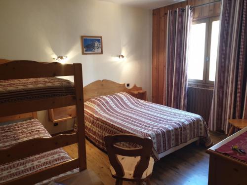 Ένα ή περισσότερα κρεβάτια σε δωμάτιο στο Résidence la Stellina