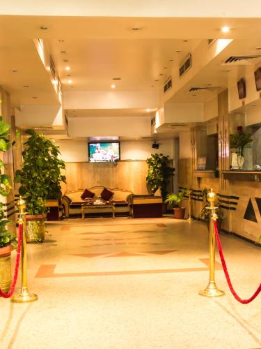 a lobby of a hotel with a red ribbon at Marhaba Palace Hotel in Aswan
