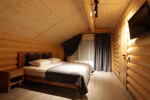 เตียงในห้องที่ Bozhena