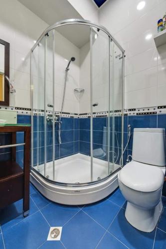 a bathroom with a shower and a toilet in it at House 52 Boutique Hotel in Tbilisi City