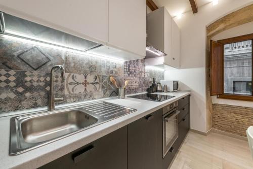 a kitchen with a sink and a counter top at Borro Palace in Cagliari