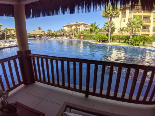 a view of the pool from the balcony of a resort at VG Sun Cumbuco Sea Breeze Vista Mar in Cumbuco