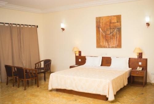 Postel nebo postele na pokoji v ubytování Hôtel Marbella