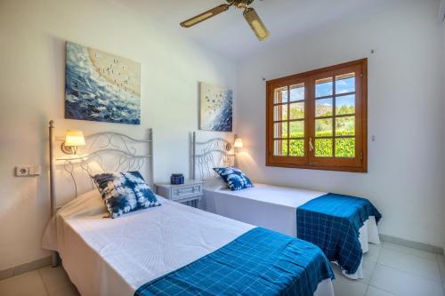 Posteľ alebo postele v izbe v ubytovaní Villa Vora Puerto Pollensa by JS Villas