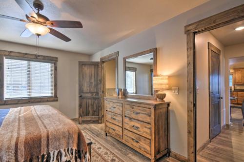 a bedroom with a bed and a dresser and a mirror at Longview Lodge with Furnished Deck and Fire Pit! in Alton
