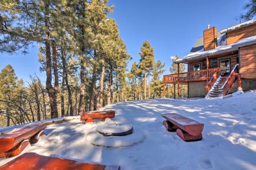 a snow covered yard in front of a house at Longview Lodge with Furnished Deck and Fire Pit! in Alton
