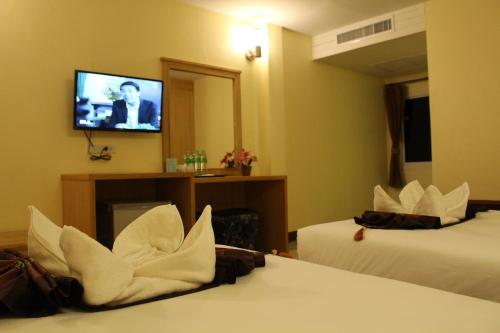 Ένα ή περισσότερα κρεβάτια σε δωμάτιο στο The Lephant Hotel