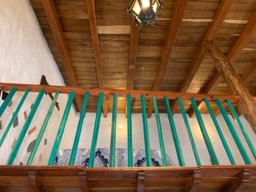 a row of green spires in a wooden ceiling at Casa Miguel Arcangel in Coatepec