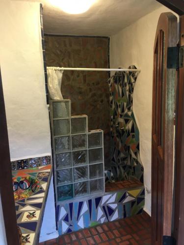 a room with a ladder with stained glass windows at Casa Miguel Arcangel in Coatepec