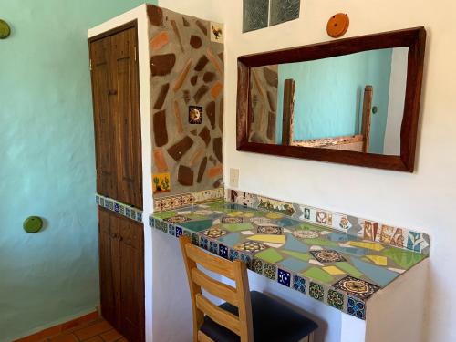 a bathroom with a counter top and a mirror at Casa Miguel Arcangel in Coatepec