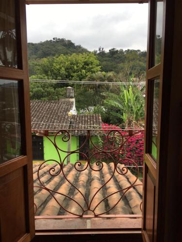a view from an open door of a balcony at Casa Miguel Arcangel in Coatepec