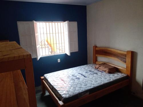 Postel nebo postele na pokoji v ubytování Residencial Santos