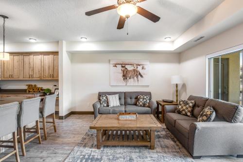 a living room with a couch and a table at Estancia Enchantment in St. George