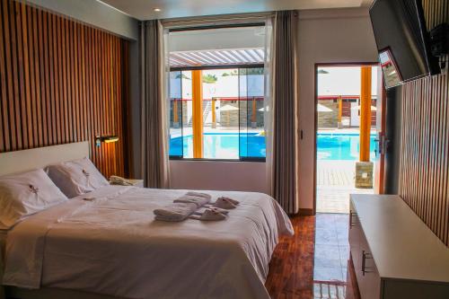 Postel nebo postele na pokoji v ubytování Resort la Fogata Cieneguilla