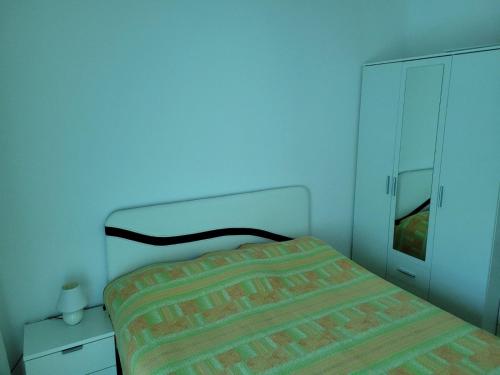 Ein Bett oder Betten in einem Zimmer der Unterkunft Apartman Petra