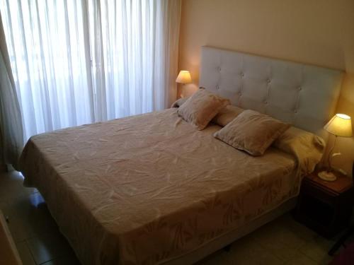 En eller flere senge i et værelse på Acuario 7