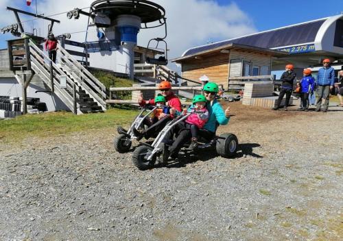 a group of children riding on a dirt bike at Haus Raich in Arzl im Pitztal
