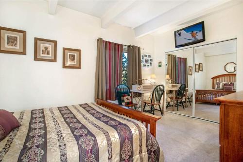 a bedroom with a bed and a dining room at Lakeview A-303 - Dillon in Dillon