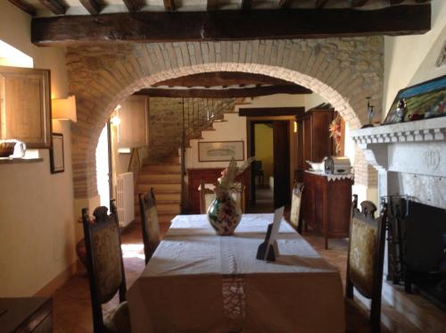 En eller flere senge i et værelse på Agriturismo San Bartolomeo