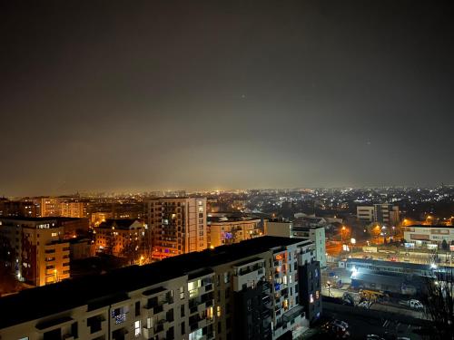 a view of a city at night with lights at Stunning 2-Room Penthouse with Lakeview W11 in Bucharest