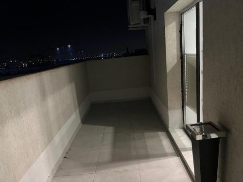 a room with a view of a city at night at Stunning 2-Room Penthouse with Lakeview W11 in Bucharest