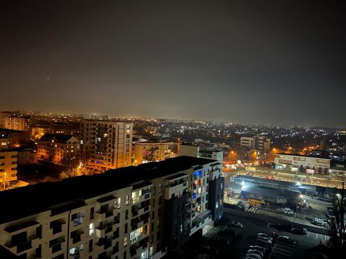 a view of a city at night with lights at Stunning 2-Room Penthouse with Lakeview W11 in Bucharest