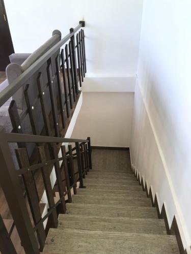 a stairway in a church with wooden stairs at Om yoga Shala Beruwala in Beruwala