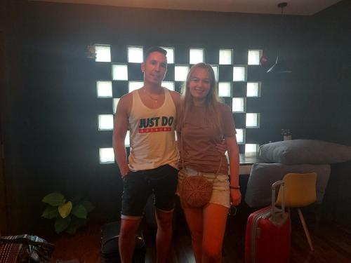 a man and a woman standing in a room at Eden Studio Apartments - 1 in Colombo