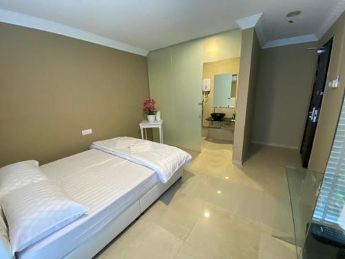 a bedroom with a bed and a bathroom at ONE AMPANG HOTEL in Ampang