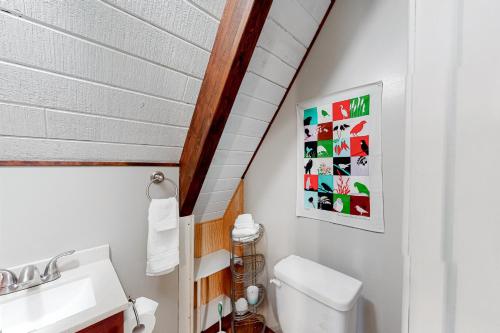 a bathroom with a toilet and a sink at Cozy Cabin Retreat in South Lake Tahoe