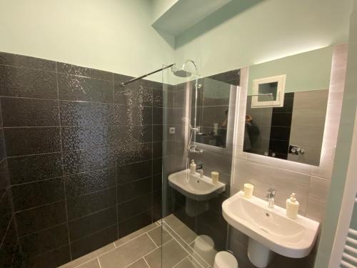 a bathroom with a sink and a mirror at Center of Budapest Apartment 3 in Budapest