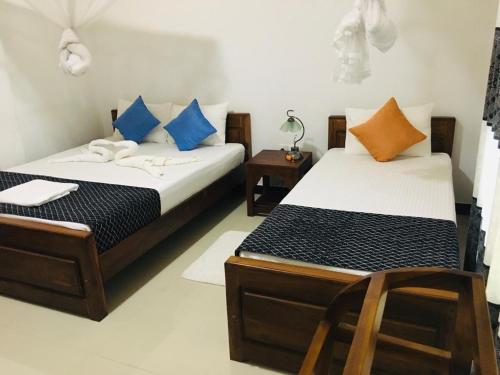 Postel nebo postele na pokoji v ubytování Restwell Homestay