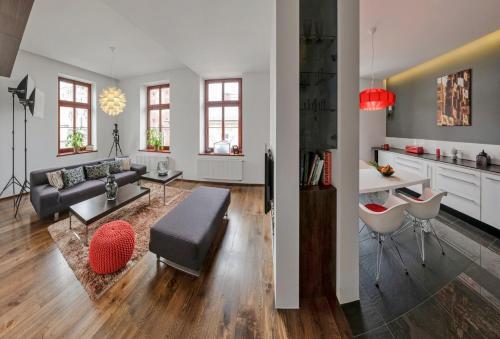 a living room with a couch and a table at Apartament ST1 in Cieszyn