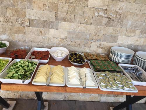 a table with many different types of food on it at Vespera hotel in Dalyan