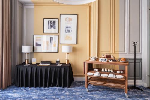a table with a black table cloth in a room at voco Grand Central Glasgow by IHG in Glasgow
