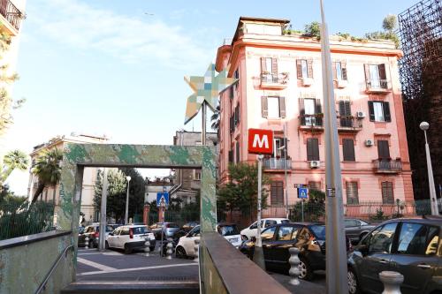 a city street with cars parked on the street at Materdays 24 in Naples