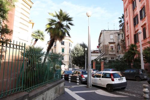 a street with cars parked on the side of the road at Materdays 24 in Naples