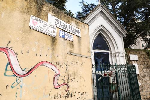 a wall with graffiti on the side of a building at Materdays 24 in Naples