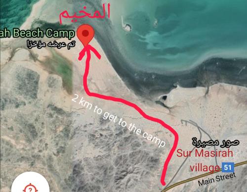 a map of the beach camp with a red marker at Masirah Beach camp in Al Qārin