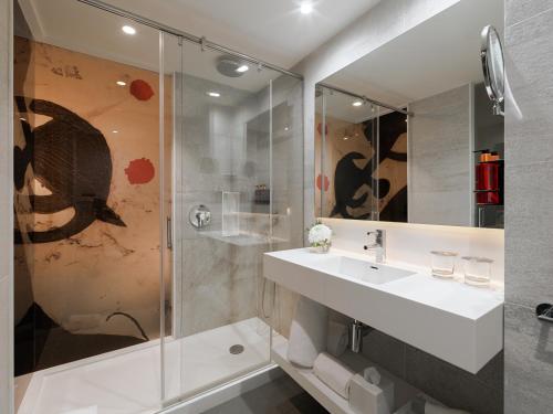 a bathroom with a sink and a shower at H10 Art Gallery 4* Sup in Barcelona