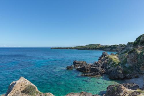 a view of the ocean from a rocky beach at Armonia Seaside Villas in Vasilikos